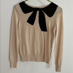 J. Crew cream and black sweater with faux bow neck